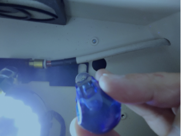 A person holding a blue object
Description automatically generated